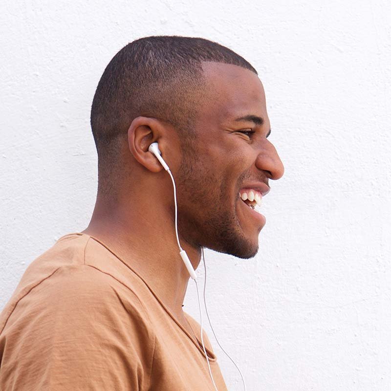 portrait-of-afro-american-man-listening-music-agai-CAJQK28.jpg